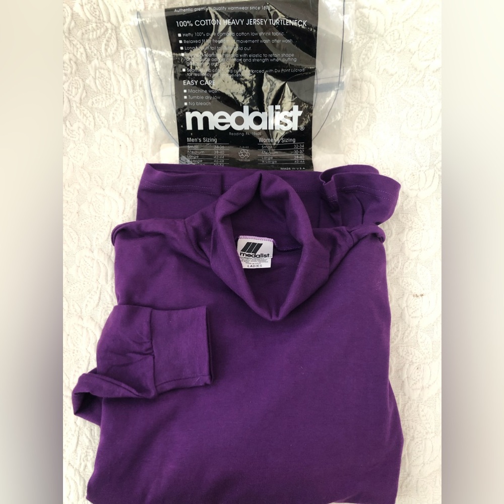 New Medalist Women’s purple turtleneck. 100% cotton.  Size large (38-40). $18.00